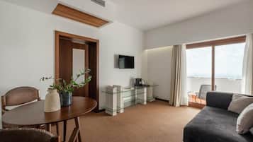 Superior Double Room, Balcony | Living area | TV
