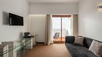 Superior Double Room, Balcony | Living area | 50-cm TV with cable channels