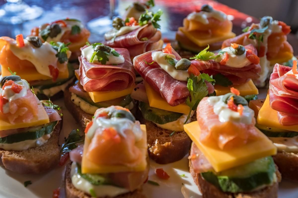 A plate of appetizers with various toppings.