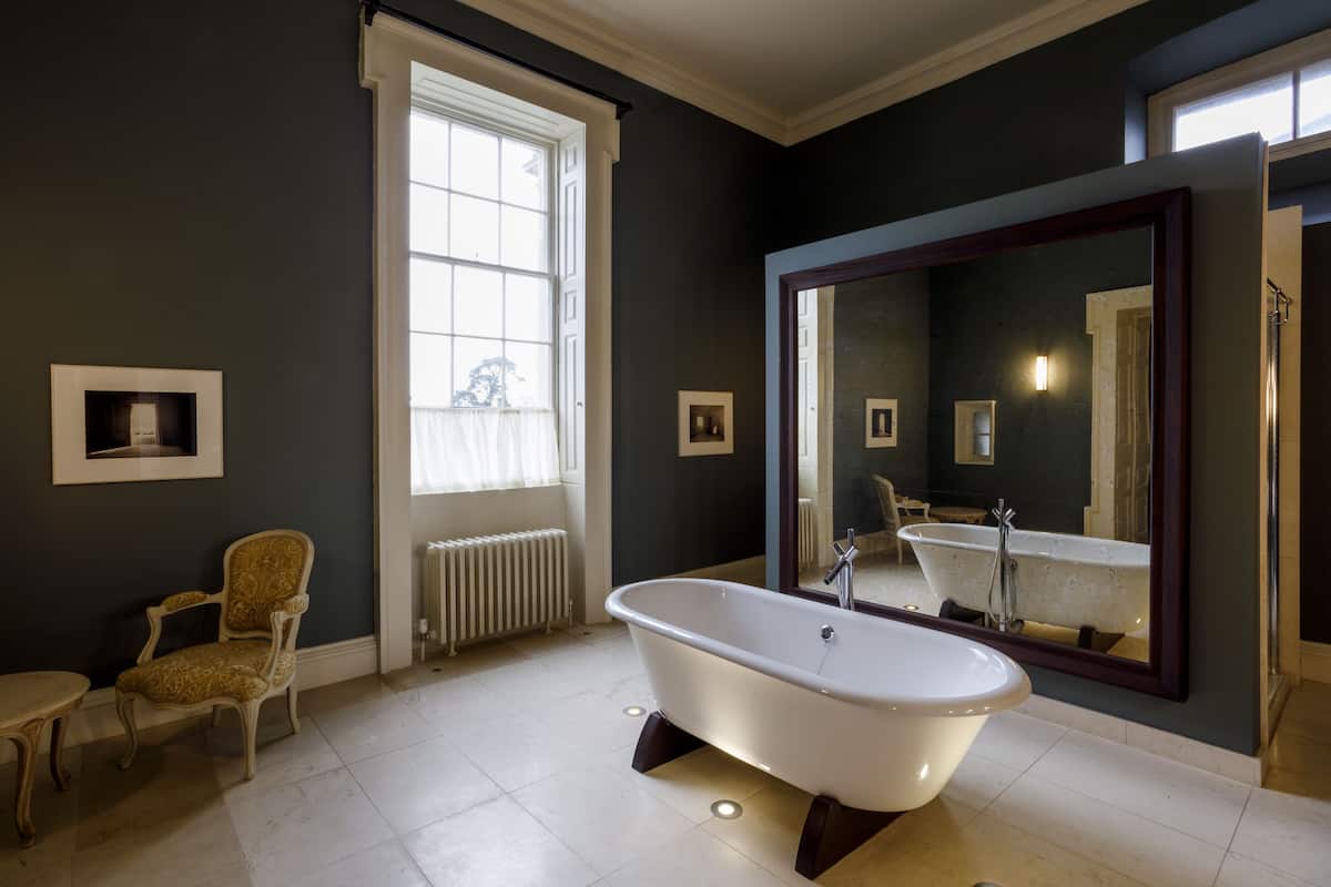 separate bathtub and shower, designer toiletries, hair dryer, slippers