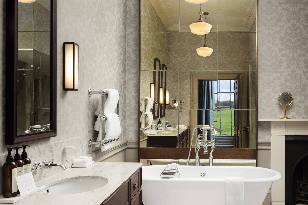 separate bathtub and shower, designer toiletries, hair dryer, slippers