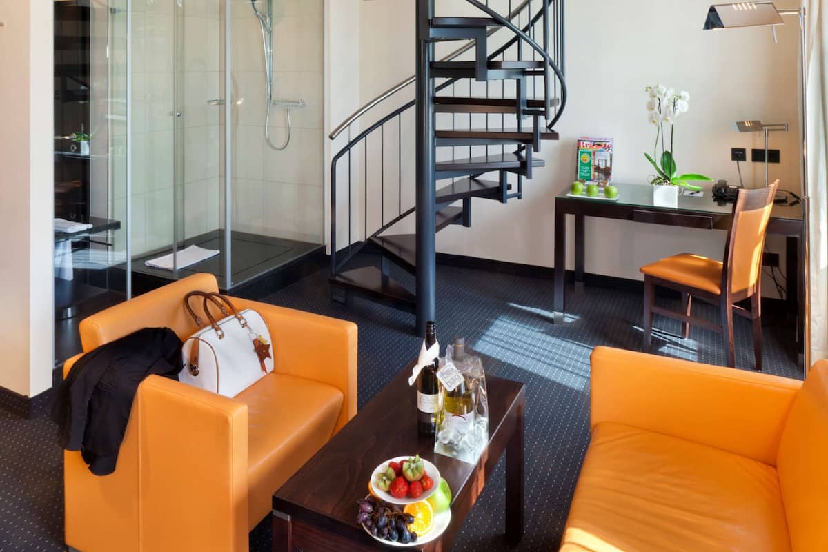 Signature Family Maisonette Studio | Living room | 50-inch Smart TV with cable channels