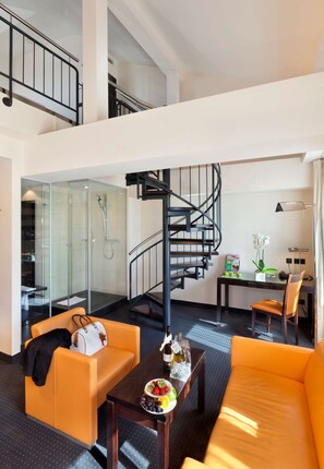 Signature Family Maisonette Studio | Living room | 50-inch Smart TV with cable channels