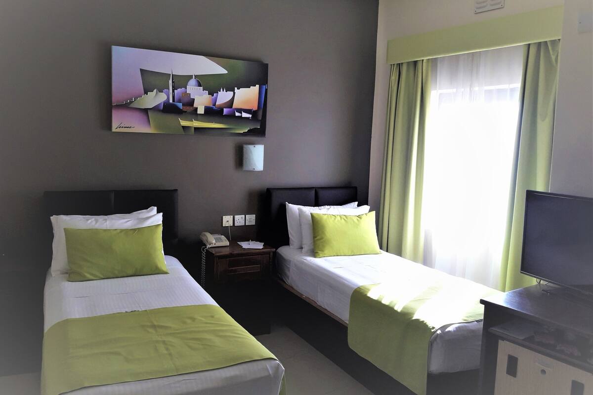 Economy Room | Minibar, in-room safe, desk, cribs (free)