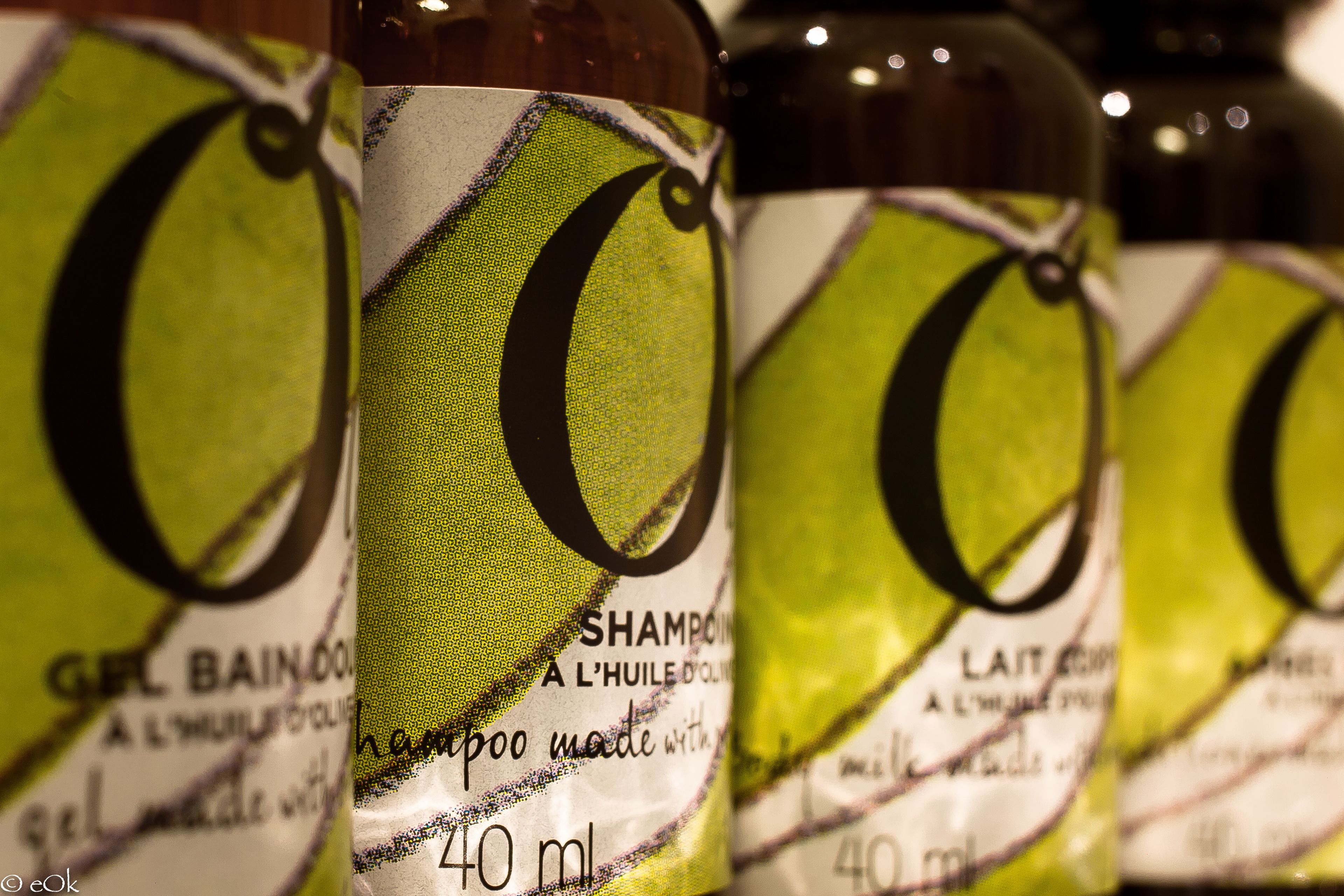 A close-up of shampoo bottles with labels.