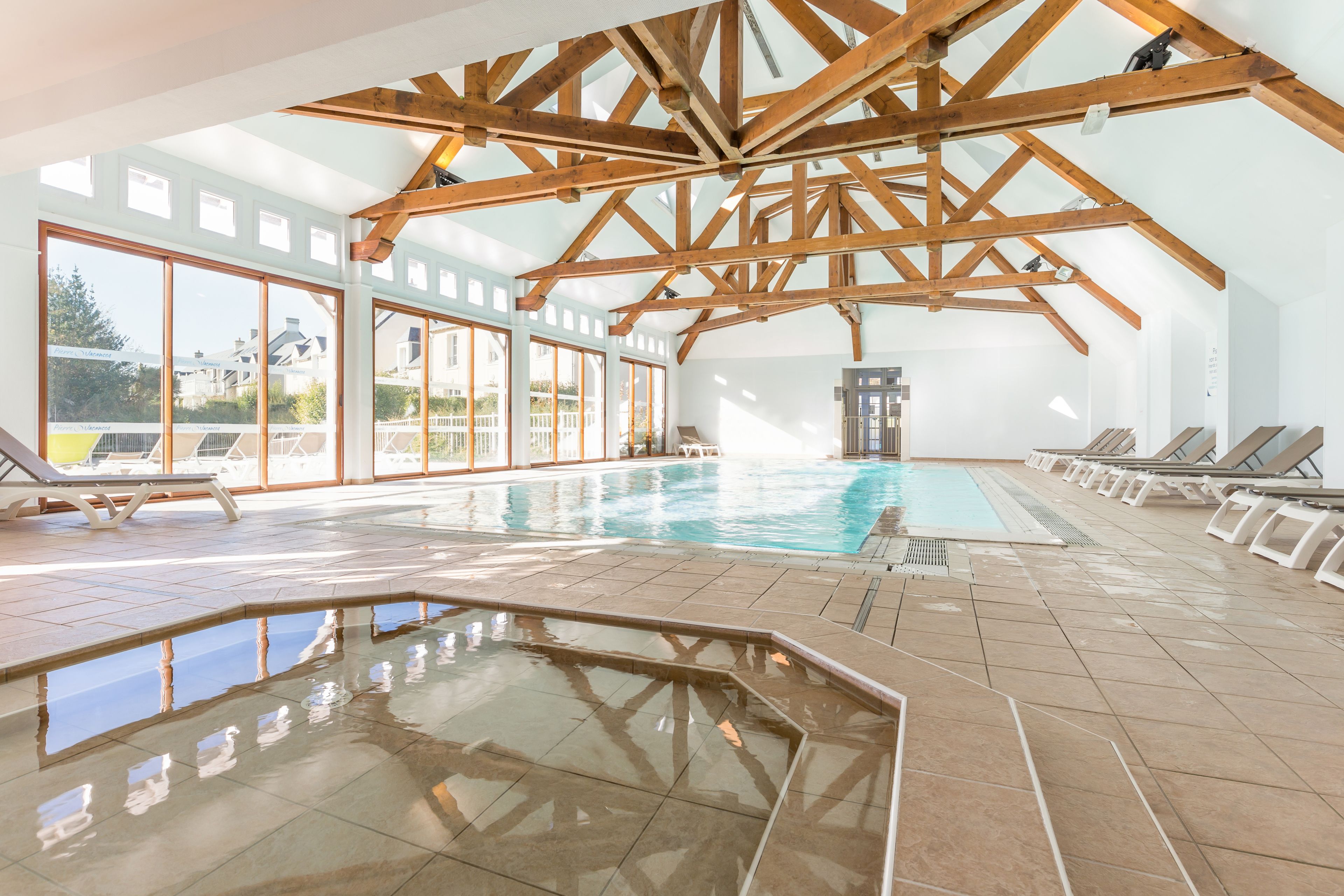 Indoor pool, seasonal outdoor pool, pool umbrellas, pool loungers