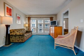 Family Suite, 1 Bedroom, Kitchen, Partial Ocean View | Living room | TV