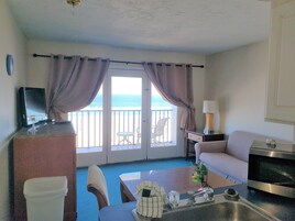 Junior Suite, 1 Bedroom, Oceanfront | Living room | TV