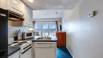 Fridge, microwave, stovetop, coffee/tea maker