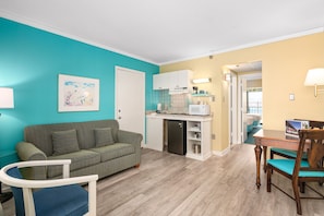 32-inch flat-screen TV with cable channels, TV, DVD player - Cayman Suites Hotel (Ocean City)