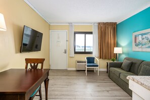 32-inch flat-screen TV with cable channels, TV, DVD player - Cayman Suites Hotel (Ocean City)