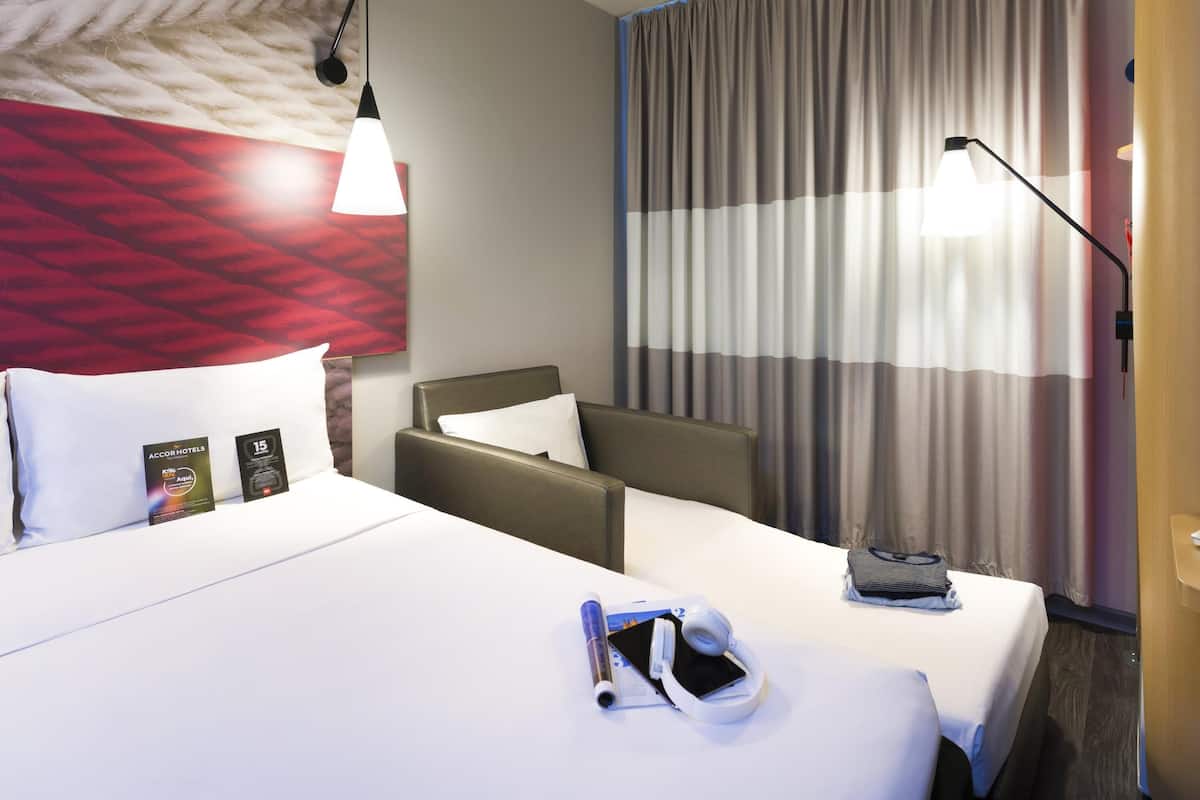 Standard Room, Multiple Beds | Minibar, desk, soundproofing, free WiFi