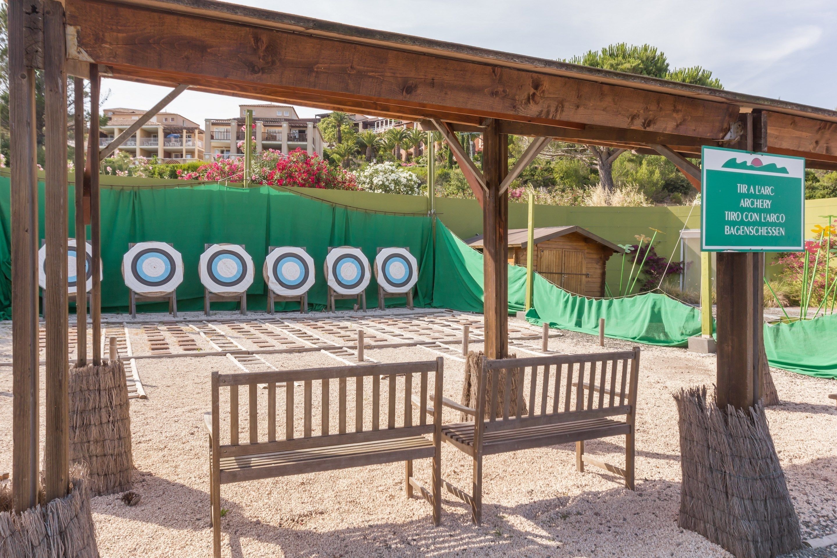 An archery range with targets and benches.