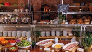 A buffet with various food items and dishes displayed on shelves and counters. - Hyatt Regency Kyoto (Kyoto)