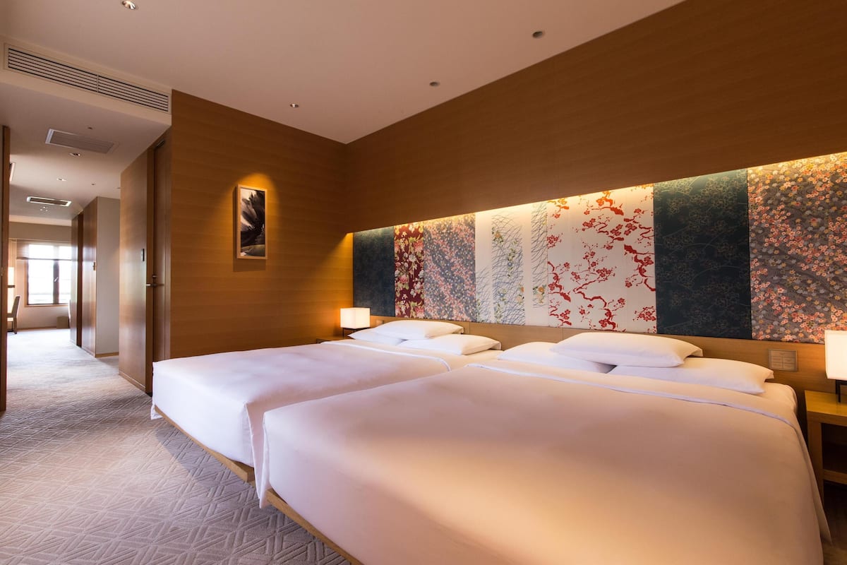 Deluxe Room, 2 Queen Beds, Corner | Minibar, in-room safe, desk, blackout curtains
