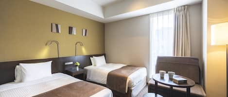 Værelse med 2 enkeltsenge - ikke-ryger | Dundyner, mørklægningsgardiner, gratis Wi-Fi, sengetøj