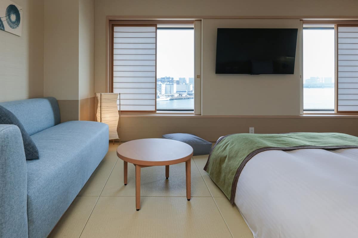 Premium bedding, desk, laptop workspace, blackout drapes