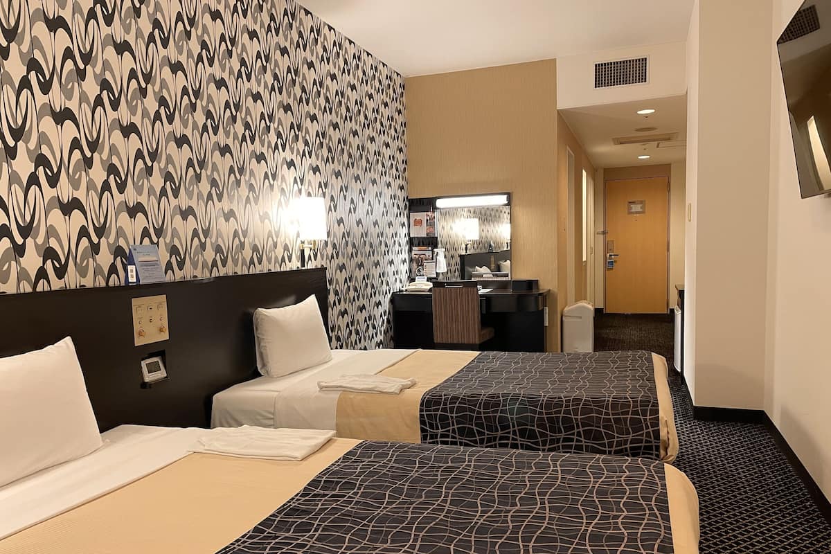 Premium bedding, desk, laptop workspace, blackout curtains