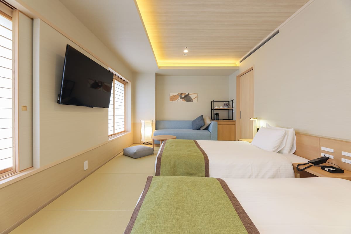 Premium bedding, desk, laptop workspace, blackout drapes