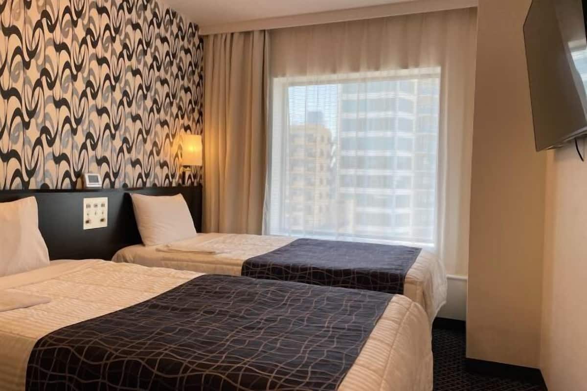 Premium bedding, desk, laptop workspace, blackout curtains
