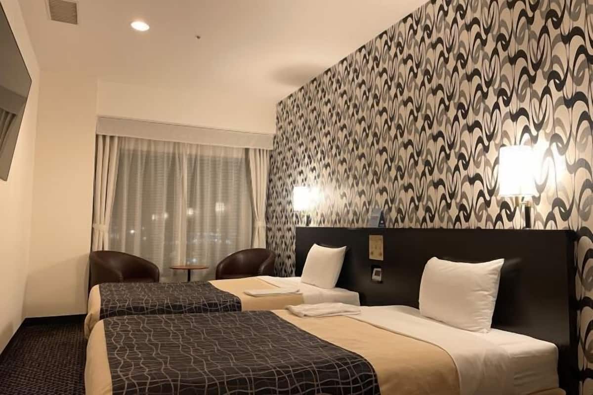 Premium bedding, desk, laptop workspace, blackout curtains