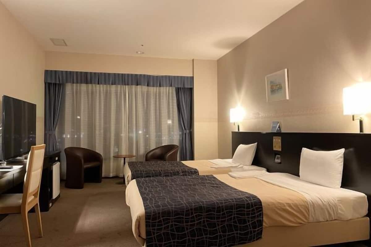 Premium bedding, desk, laptop workspace, blackout curtains
