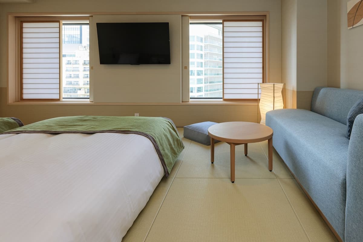 Premium bedding, desk, laptop workspace, blackout drapes