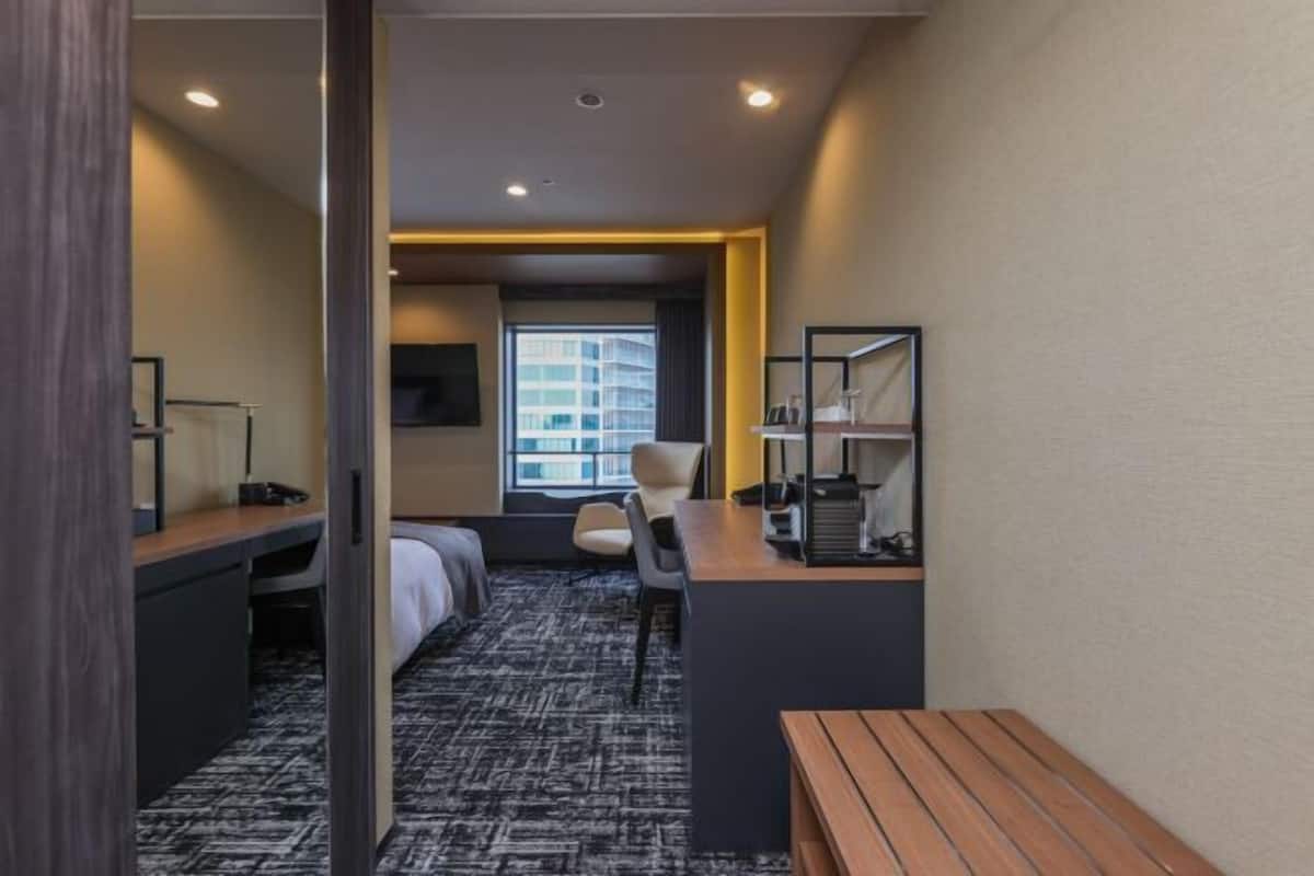 Premium bedding, desk, laptop workspace, blackout curtains