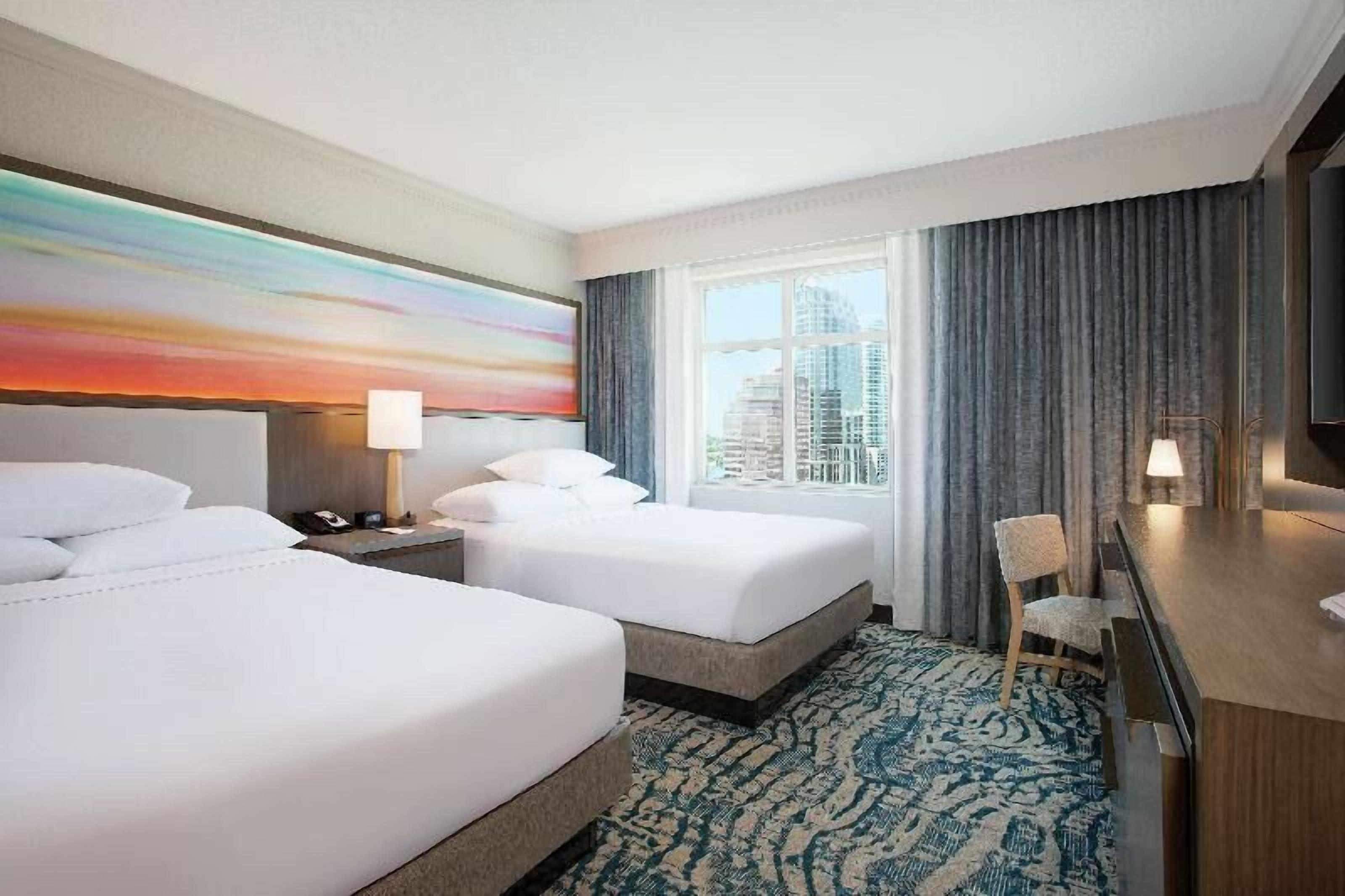 Hypo-allergenic bedding, down comforters, pillowtop beds, in-room safe