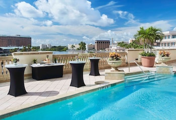 Outdoor pool, sun loungers at Embassy Suites by Hilton Tampa Downtown Convention Center
