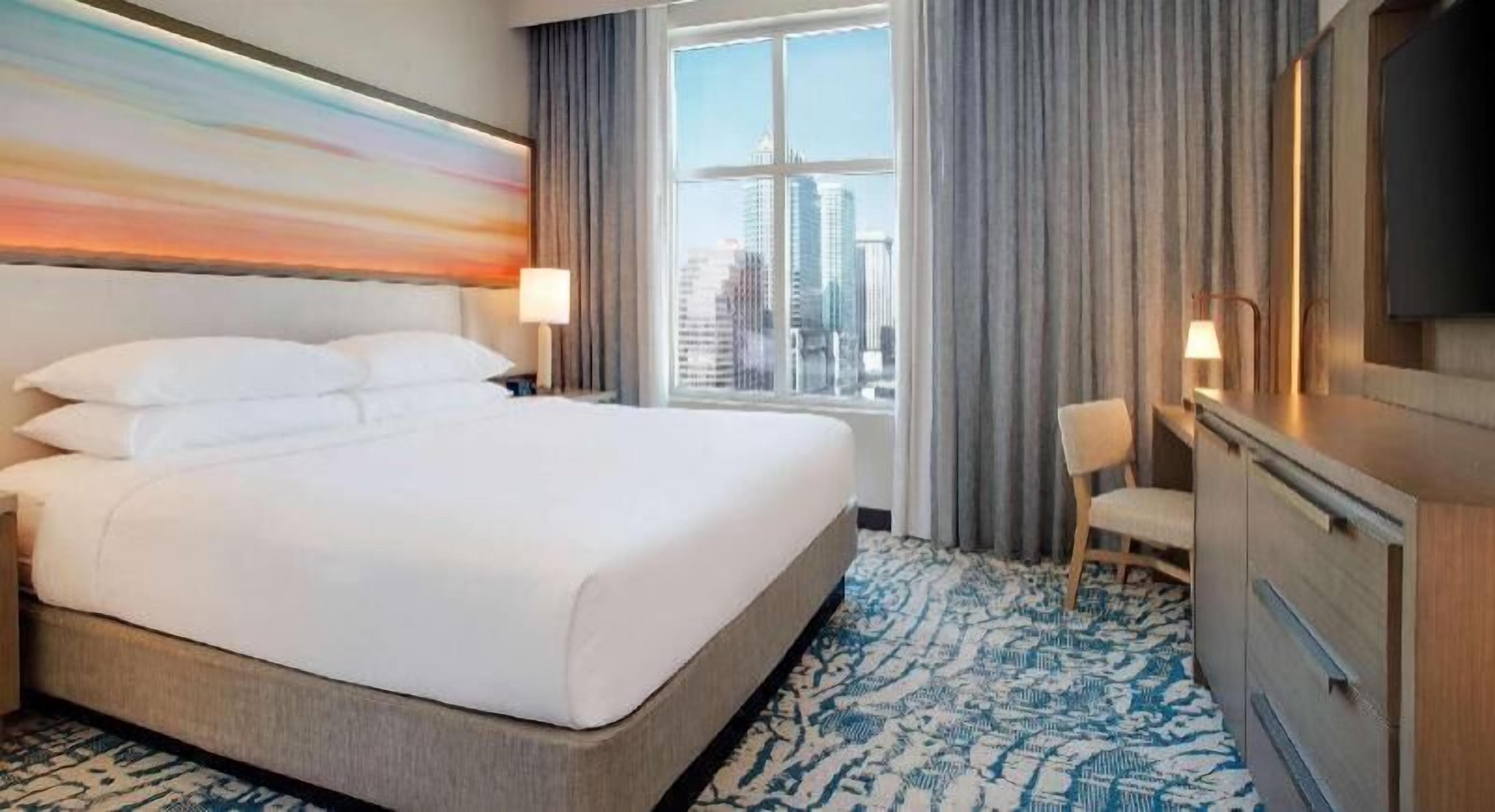 Hypo-allergenic bedding, down comforters, pillowtop beds, in-room safe
