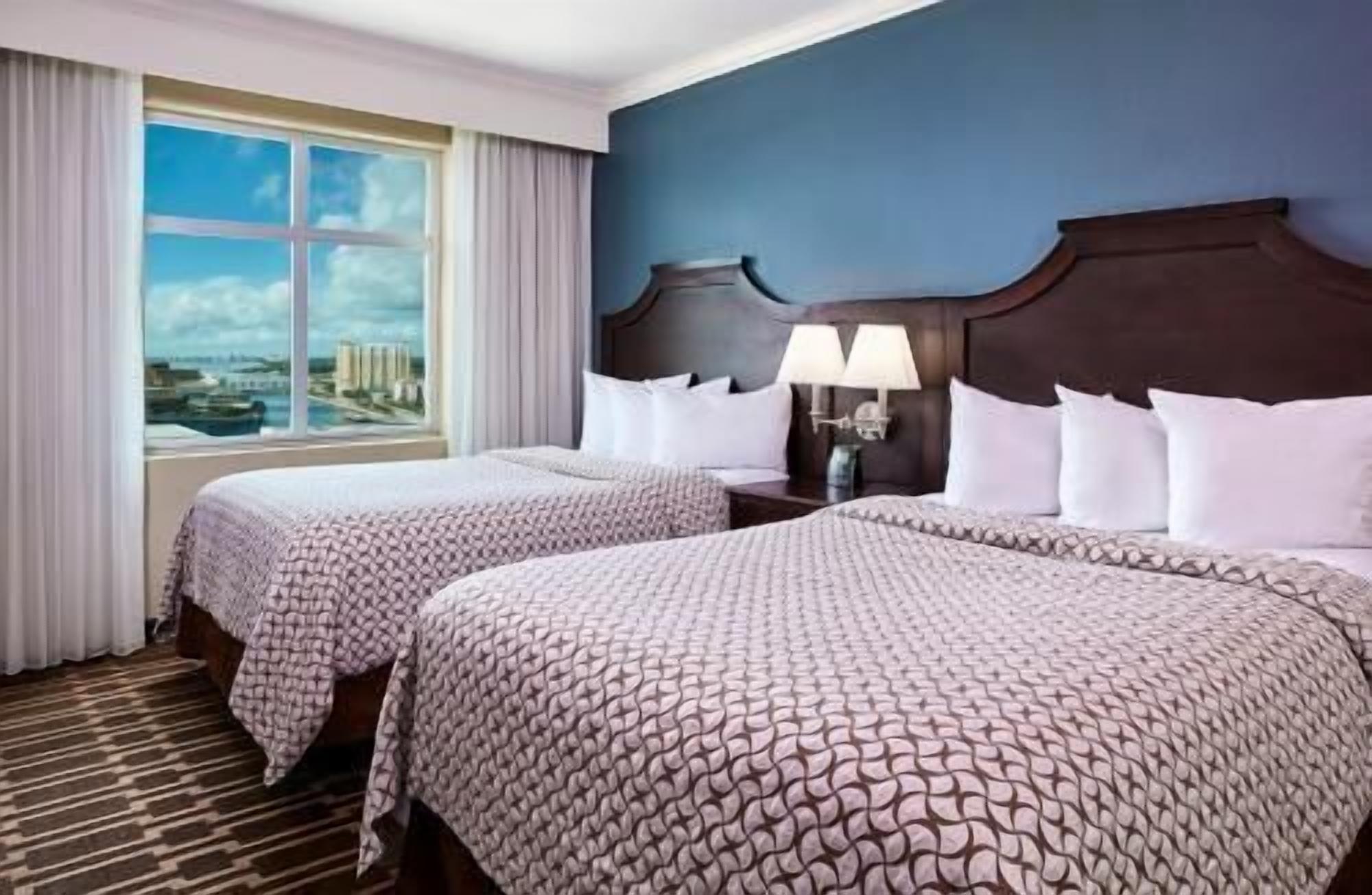 Hypo-allergenic bedding, down comforters, pillowtop beds, in-room safe