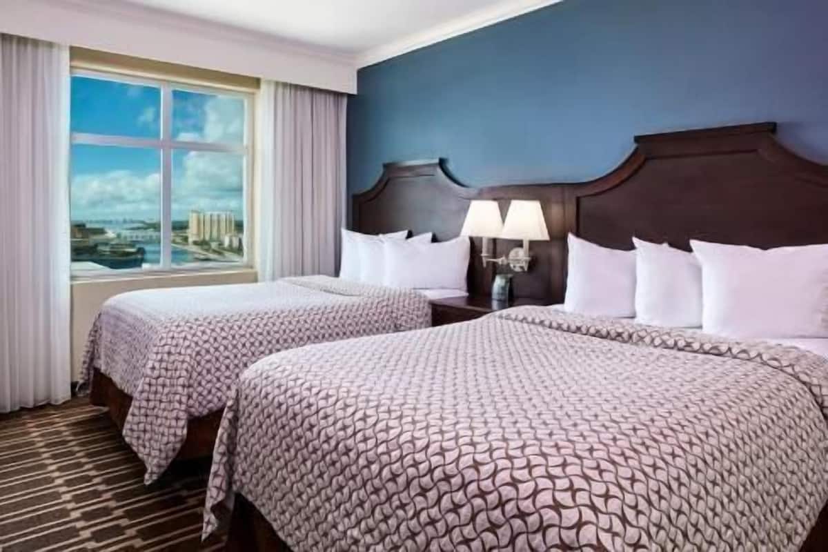 Hypo-allergenic bedding, down comforters, pillowtop beds, in-room safe