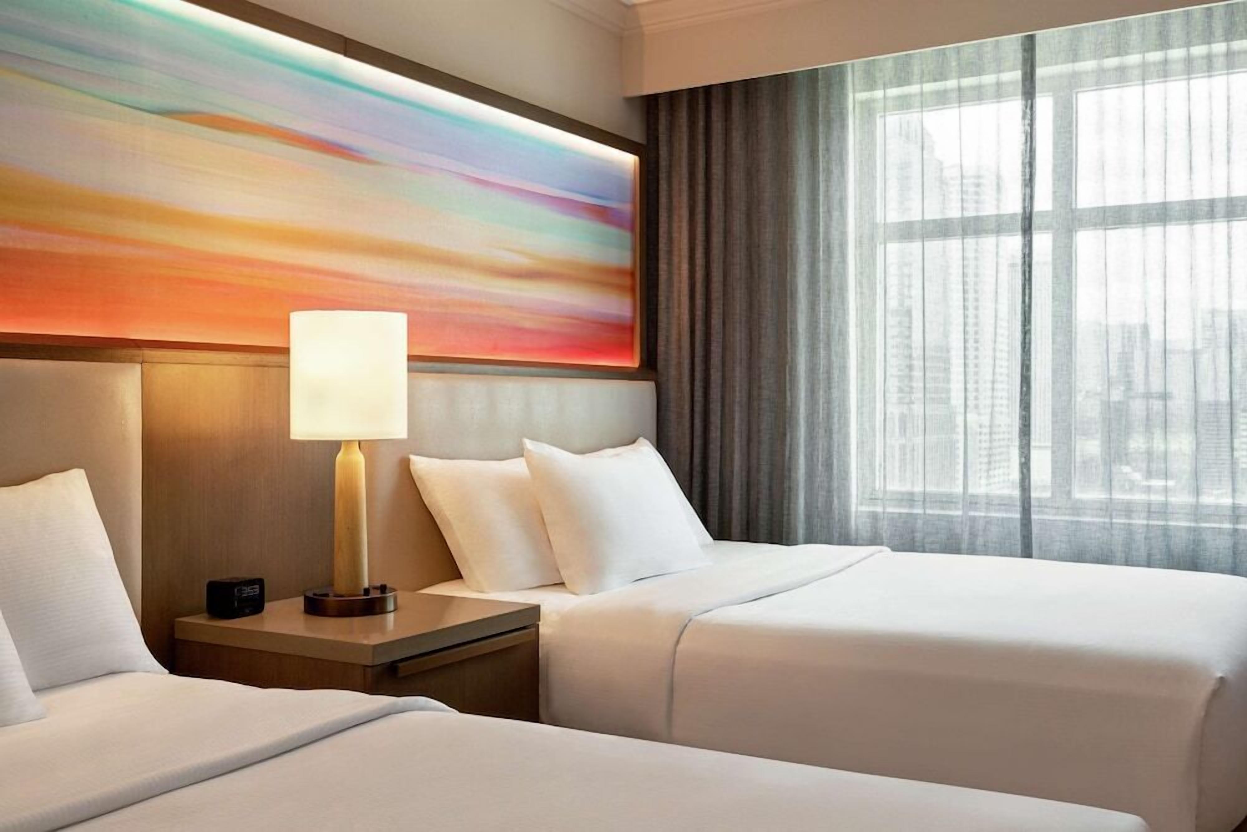 Hypo-allergenic bedding, down comforters, pillowtop beds, in-room safe