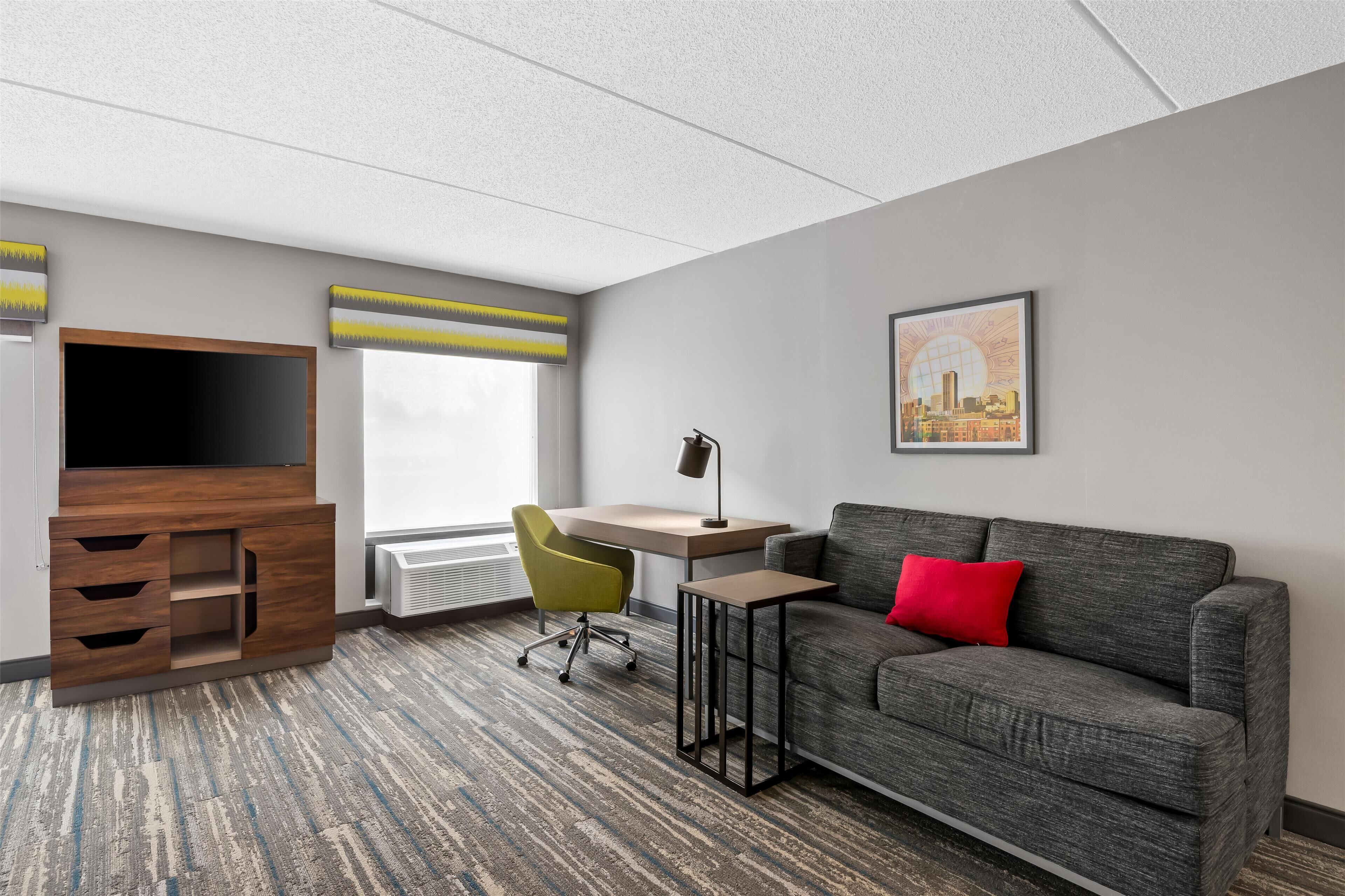 studio suite, multiple beds | living area | 37-inch tv with cable channels, pay films