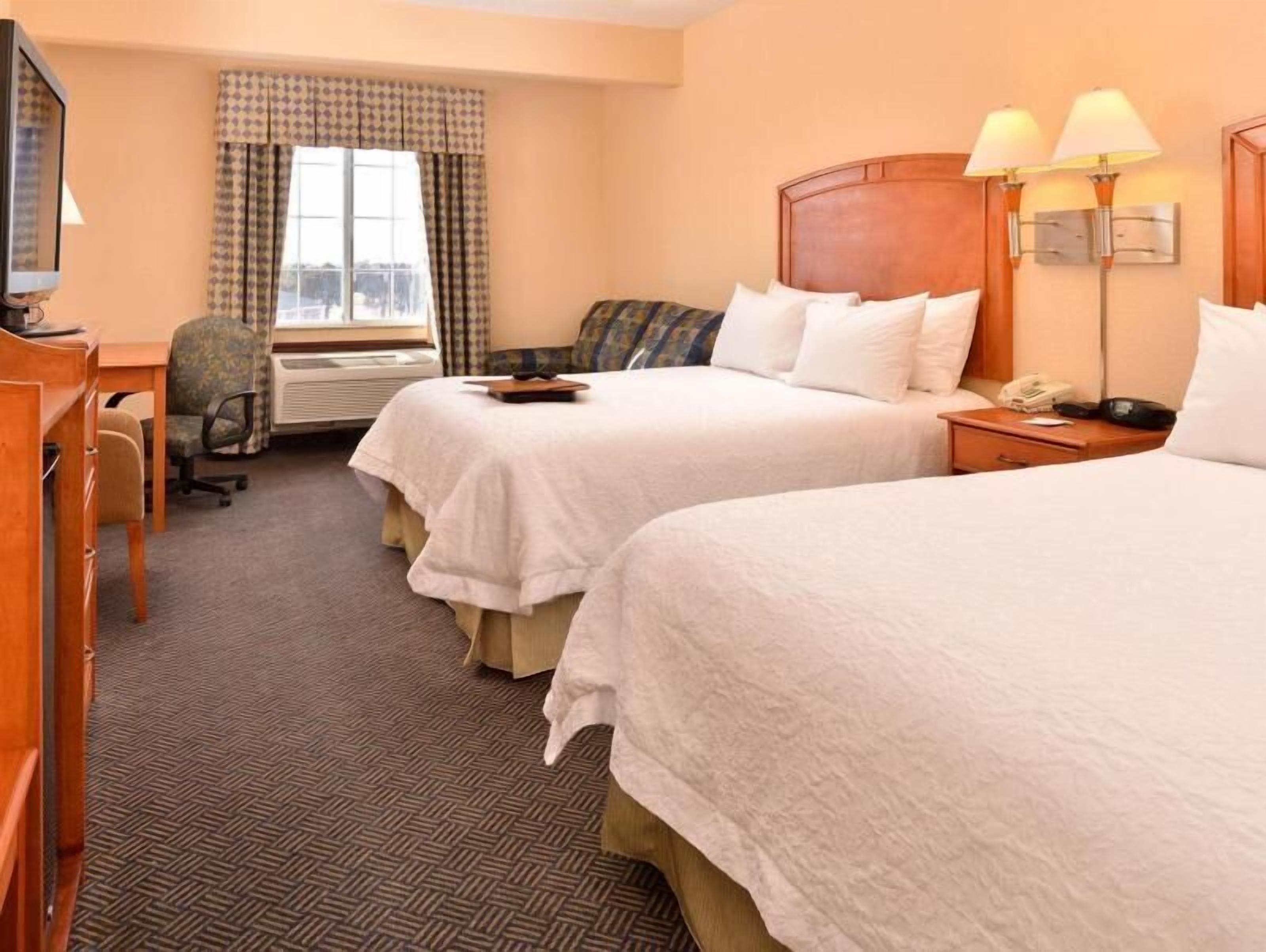 Premium bedding, pillow-top beds, blackout curtains, iron/ironing board