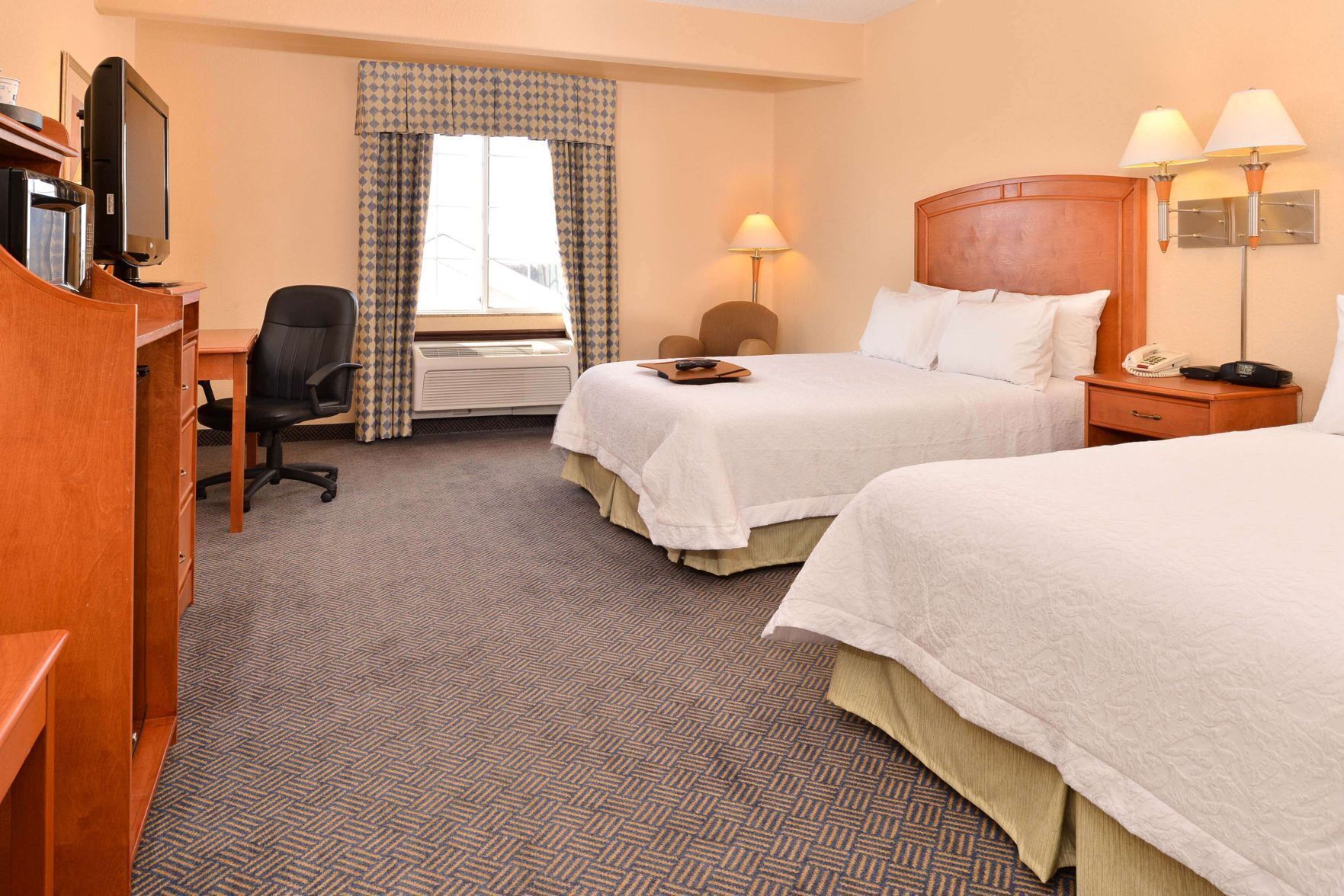 Premium bedding, pillow-top beds, blackout curtains, iron/ironing board