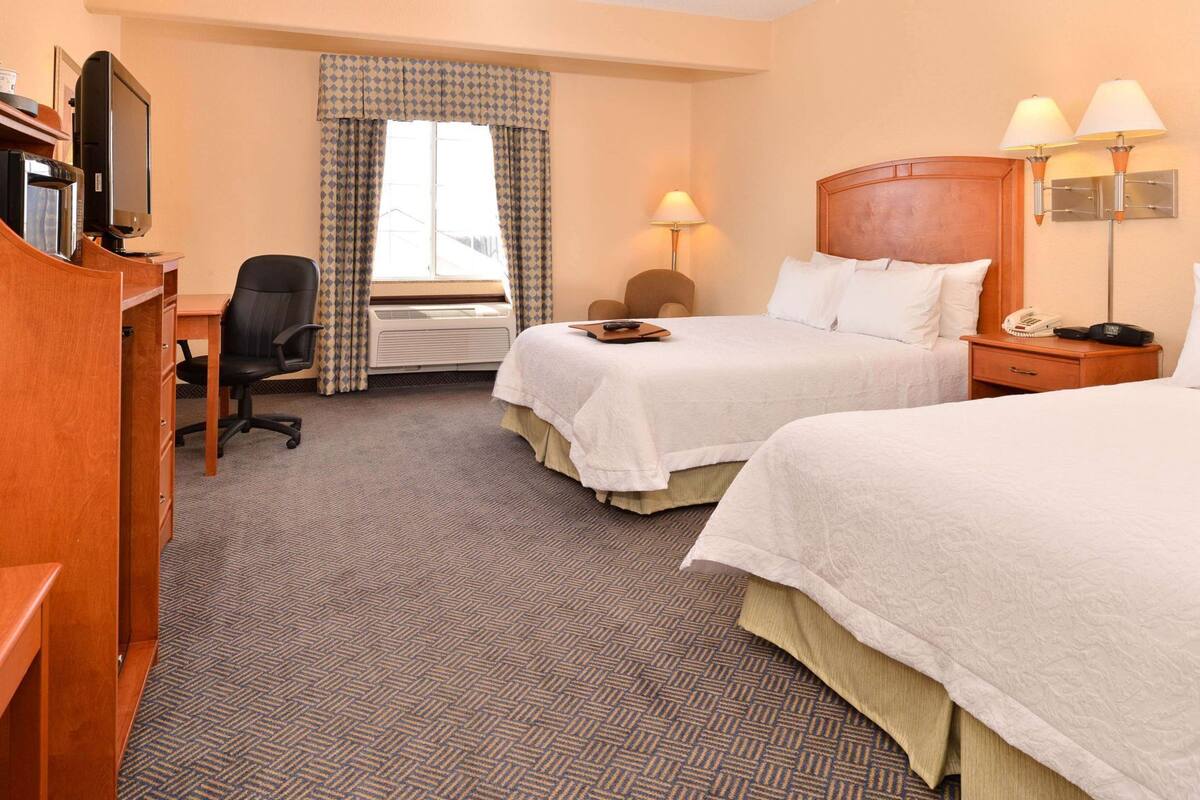 Premium bedding, pillow-top beds, blackout curtains, iron/ironing board