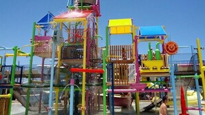 A water play area with various structures and slides. - Homewood Suites by Hilton Daytona Beach Speedway-Airport (Daytona Beach)