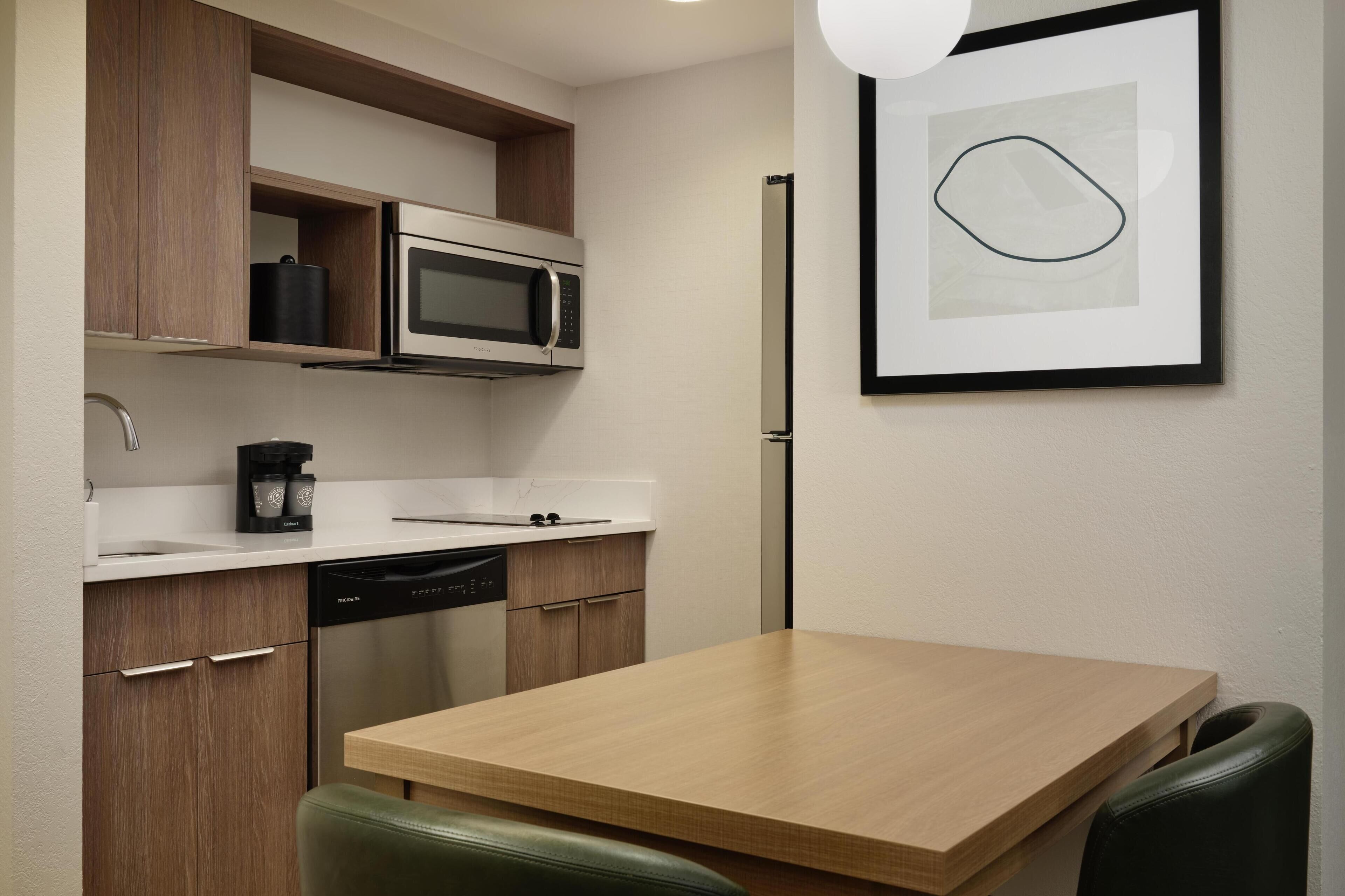 Full-sized fridge, microwave, stovetop, dishwasher