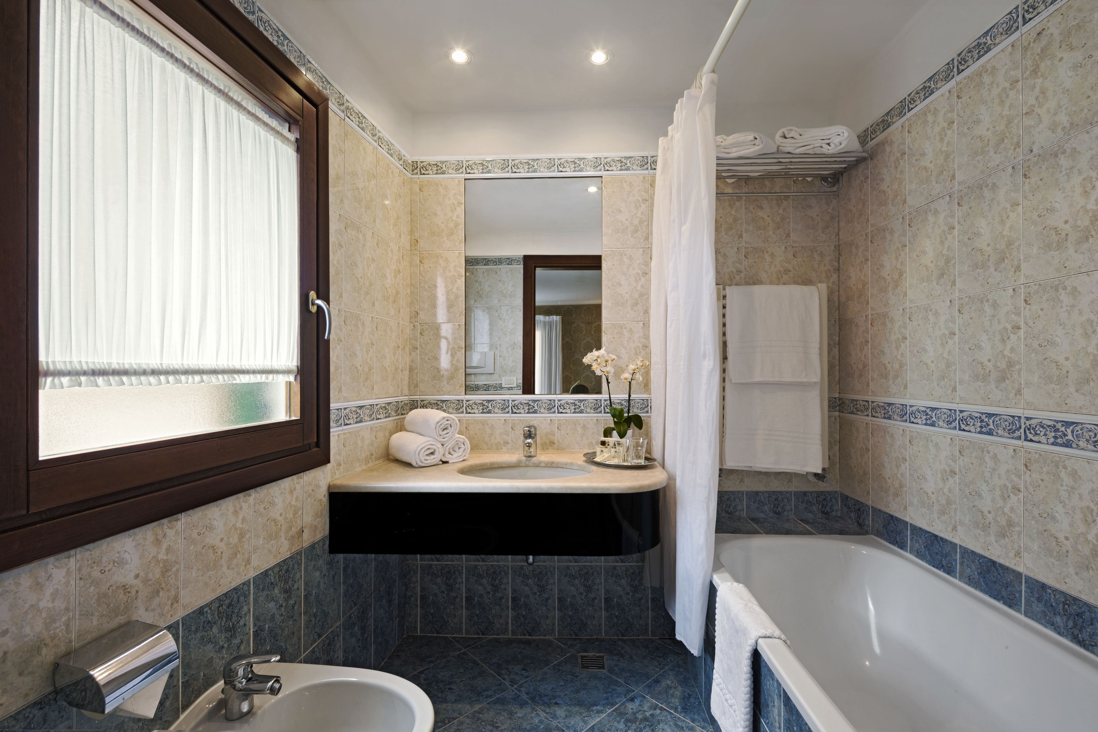 quadruple room | bathroom | free toiletries, hair dryer, slippers, bidet