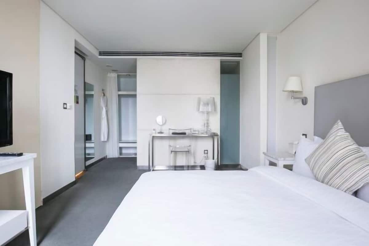 Luxe beddengoed, donzen dekbedden, een gratis minibar