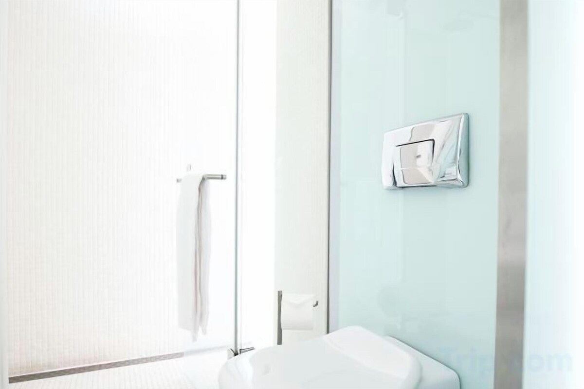 Bathroom | Hair dryer, slippers, towels, shampoo