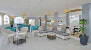 Relax in our spacious lobby with sofas, armchairs, and a dining area.