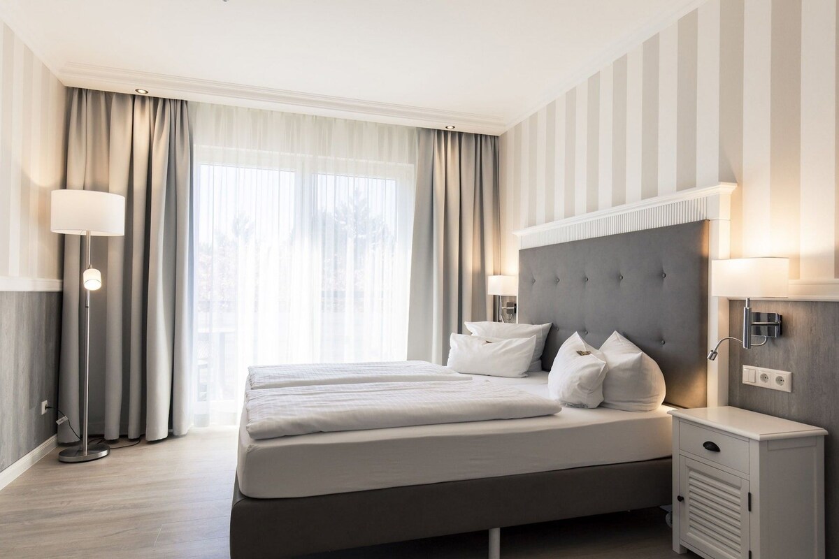 Hypoallergeen beddengoed, een minibar, een kluis op de kamer, een bureau