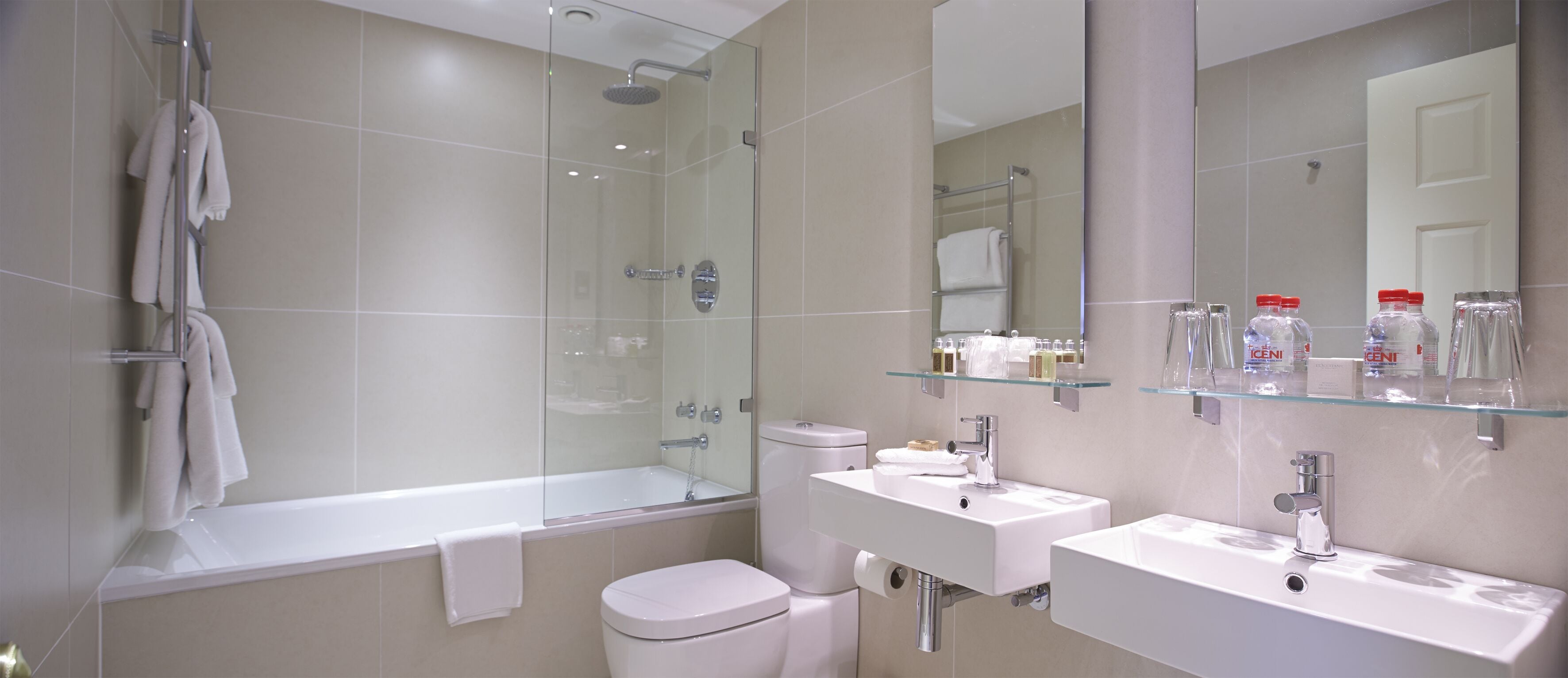 combined shower/bathtub, designer toiletries, hair dryer, towels