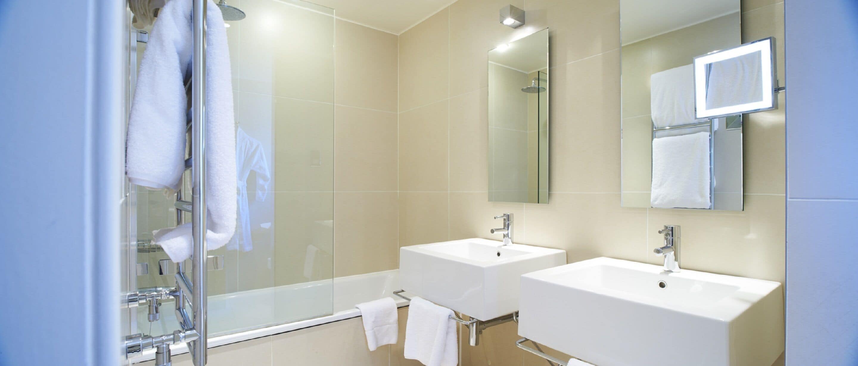 combined shower/bathtub, designer toiletries, hair dryer, towels