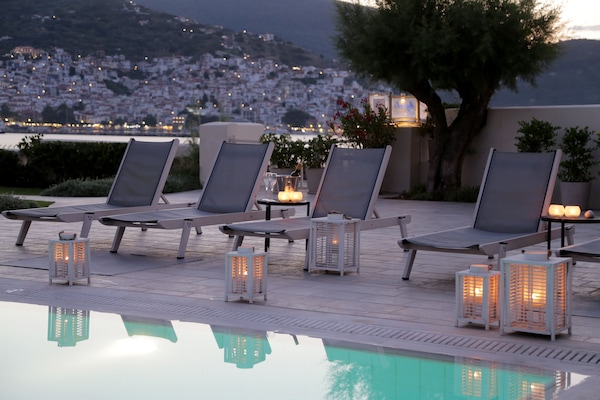 Seasonal outdoor pool, open 9:00 AM to 9:00 PM, pool umbrellas