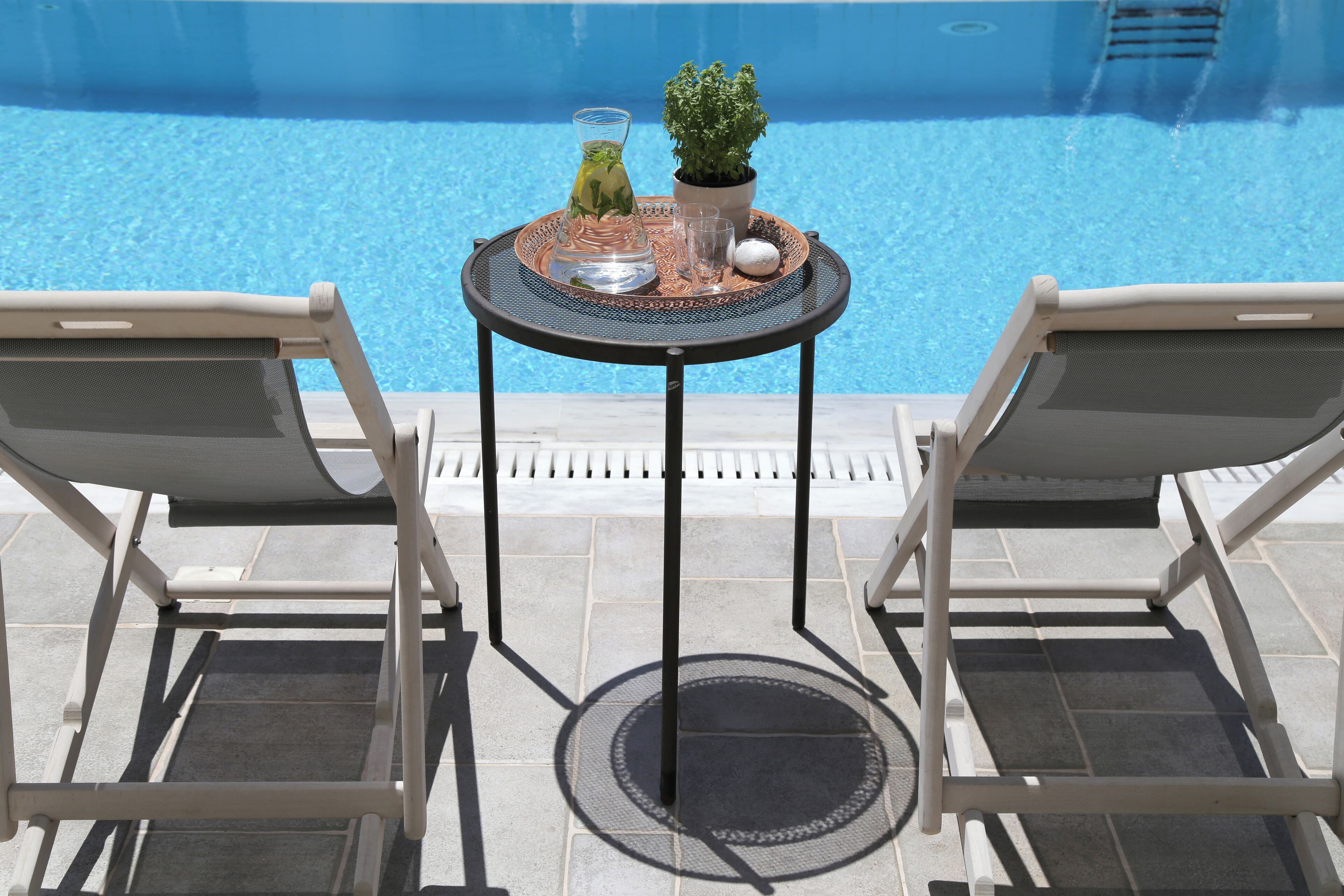 seasonal outdoor pool, open 9:00 am to 9:00 pm, pool umbrellas