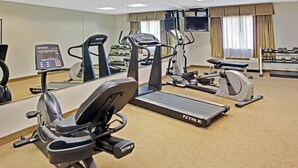 A fitness center with treadmills, elliptical machines, and free weights. - Days Inn & Suites by Wyndham Laurel Near Fort Meade (Laurel)